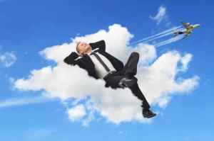 Businessman sleeping in a cloud